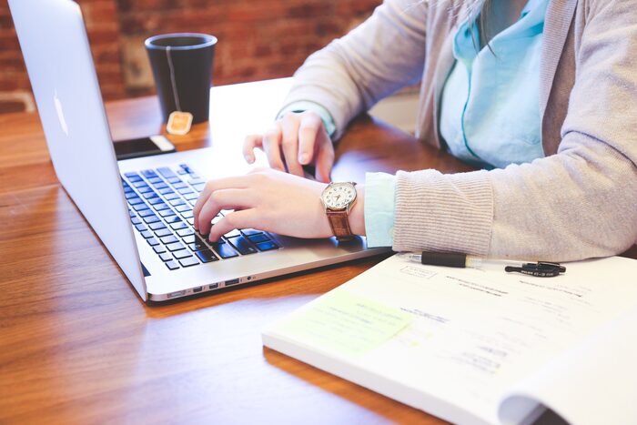 Studying with a laptop and notebook
